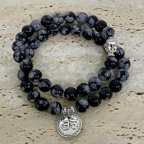 snowflake obsidian bracelet set with om and buddha charms